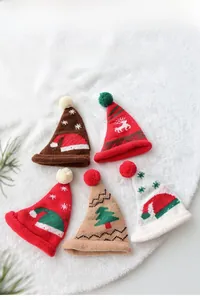 Miniature knitted Christmas hats set with reindeer and tree patterns for tree decor
