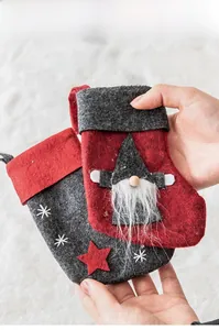 Handheld Christmas gnome felt sock pendants with red stars and white faux fur trim