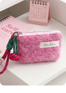 Fuzzy pink coin purse featuring a contrast woven lanyard and MiloBliss branded woven label