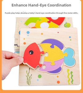 Detail of hand placing rainbow fish wooden puzzle piece for hand-eye coordination training