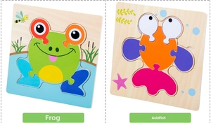 Detail view of frog and goldfish wooden 3D puzzles with colorful pieces and natural wood grain