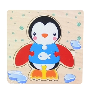 Detail of colorful wooden 3D penguin puzzle for toddlers with fish decoration