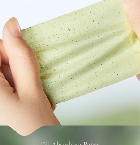 Close-up of translucent green tea oil absorbing paper showing fine plant fiber texture