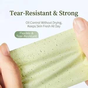 Green tea face blotting paper sheets showing strong tear resistance and durability