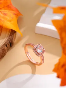 Detailed view of adjustable rose gold sugar cube ring with sparkling halo zircon stones