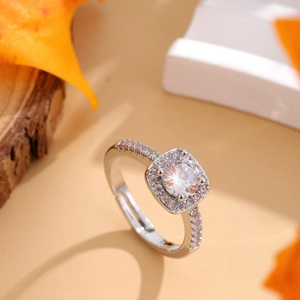 Adjustable silver halo wedding ring with round cubic zirconia and pavé diamond band