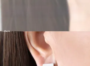 Close-up profile of a model wearing a minimalist silver rectangular stud earring