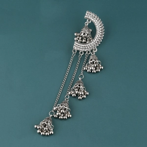 Detail of vintage silver Jhumka earrings featuring hollow bells and long tassels