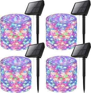Detail of 4-pack multicolor solar copper wire lights with solar panels and ground stakes