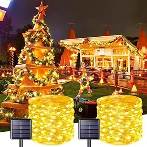 Dual solar LED copper wire lights set with warm yellow glow and stakes for outdoor gardens