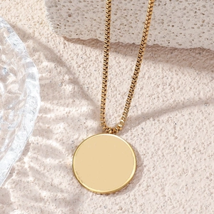 Minimalist gold stainless steel necklace with a large round pendant on box chain
