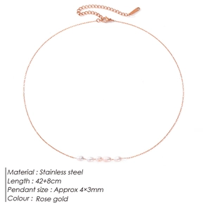 Macro detail of rose gold stainless steel necklace with five small pink freshwater pearls