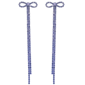 Detail of elegant bow earrings with long purple rhinestone tassels for bridal parties