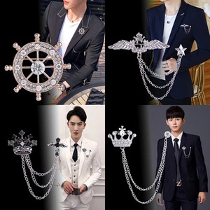 Detailed views of men's suit brooches with crown, rudder designs and metal tassels
