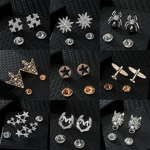 Detailed grid showing diverse metal lapel pins with stars, crowns, and moon designs