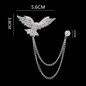 Detailed view of silver bird brooch with rhinestones and chain tassels with dimensions