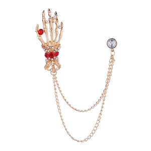 Men's gold skull hand suit brooch with red rhinestones and hanging metal tassels