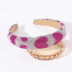 Macro shot of silver and rose red rhinestone heart headband with anti-slip velvet lining