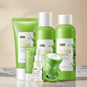 Green tea skincare set including cleanser, toner, serum, and cream on marble background