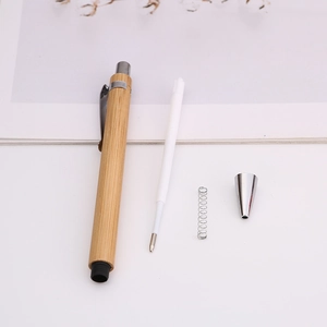 Eco-friendly bamboo ballpoint pen with natural wood texture and internal component layout