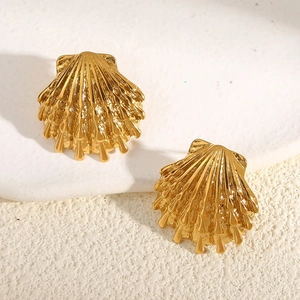 18K gold plated stainless steel star earrings with shell texture on stone background