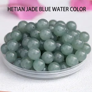 Macro detail of natural blue Hetian jade round beads for DIY jewelry making and bracelets