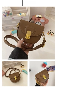 Detail shots of a vintage brown PU leather saddle bag with gold vertical metal twist lock