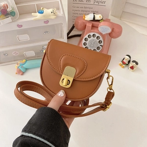 Mini caramel PU leather saddle bag for girls with golden clasp and adjustable strap