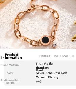 Detailed view of rose gold roman numeral bracelet with black pendant and small crystal charm