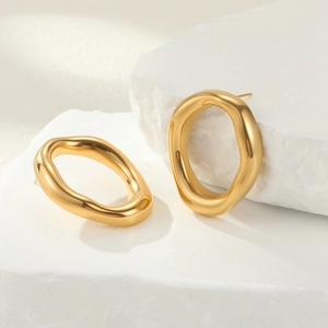 Polished gold irregular geometric earrings with liquid metal finish on natural stone