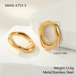 Detailed view of 3.4cm gold irregular oval earrings in polished stainless steel