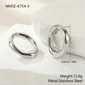 Detailed view of silver irregular oval earrings in stainless steel with 3.4cm dimensions
