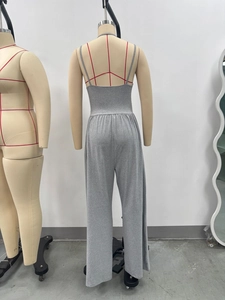 Back view of grey ribbed sleeveless jumpsuit with thin straps and wide-leg trousers