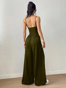 Back view of a dark olive green backless wide leg jumpsuit for summer casual wear