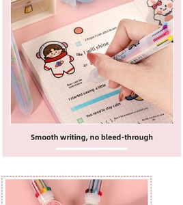 Close-up of 10-color cartoon pen writing on a grid notebook with astronaut art