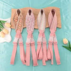Detail of 38mm colorful patterned wide bag straps with adjustable pink plastic buckles