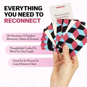 Close-up of a person holding fanned-out interactive cards from the Couples Stories game set
