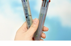 Close-up of 10-color retractable ballpoint pen with cartoon cat and rabbit prints