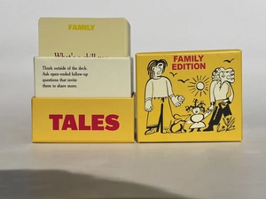 Detail of English family dialogue card game with yellow box and illustrated cards