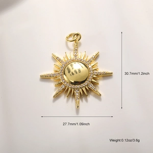 Macro view of gold sunburst pendant with sparkling rhinestones and size measurements