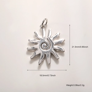 Detailed view of silver sun pendant with spiral center and ray edges showing dimensions