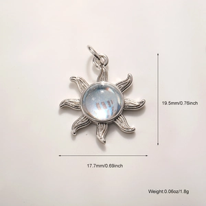 Macro view of silver sun charm showing 19.5mm height and 17.7mm width details