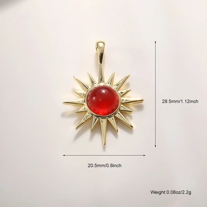 Detailed view of gold sun pendant with red gemstone and technical size dimensions