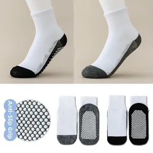 Detail view of non-slip dots on the sole of breathable cotton blend baby floor socks