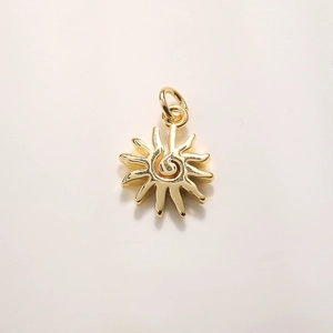 Detailed macro view of the 18k gold plated sun pendant with radiant rays and jump ring