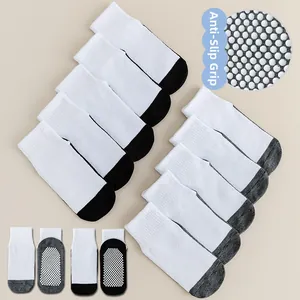 Detail of anti-slip silicone dots and mesh texture on baby cotton sports socks