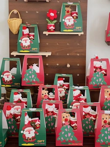 Christmas gift set with ceramic mug and plush toy in festive red and green carry box