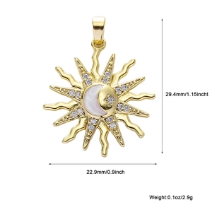 Detailed view of gold sun and moon pendant with white crystals measuring 29.4mm in height