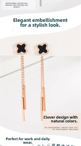 Detail of rose gold clover earrings with long chain tassels and rectangle drops
