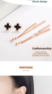 Detail of rose gold clover tassel earrings featuring black enamel and elegant long chains
